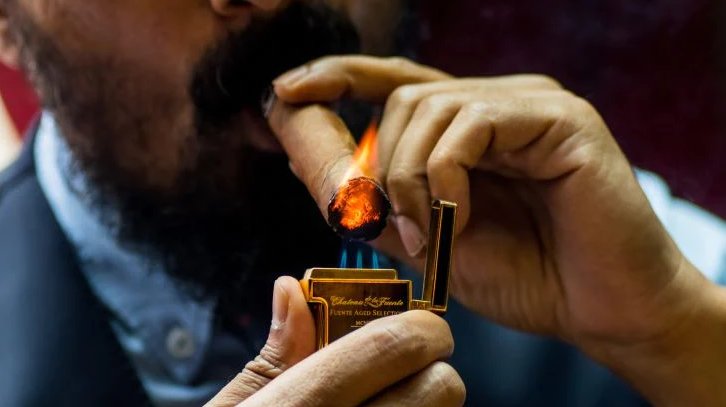 lighting a cigar
